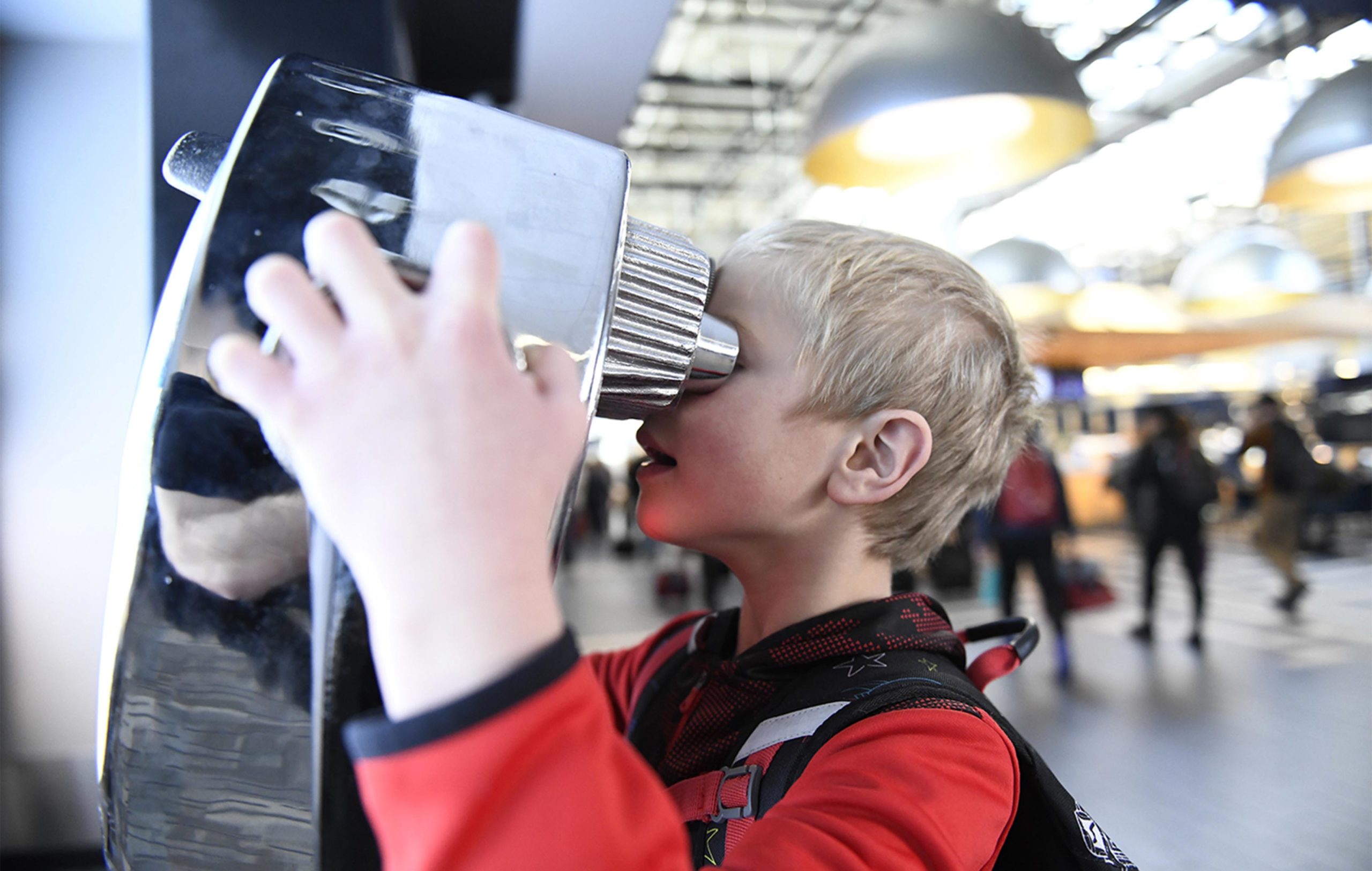 New-Thought-Visit-Jackson-Hole-Stay-Wild-Campaign-Child-Using-VRnocular-In-Airport-fullscreen
