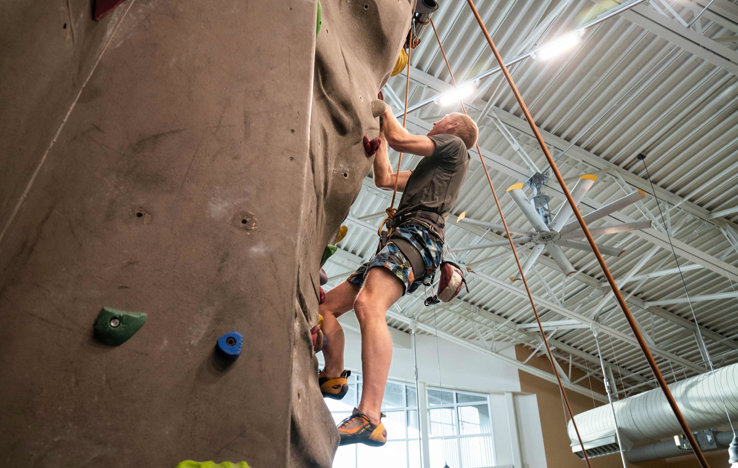 New-Thought-Visit-Pinedale-Wyoming-Ad-Photography-Man-Indoor-Rock-Climbing-At-Pinedale-Aquatic-Center-fullscreen