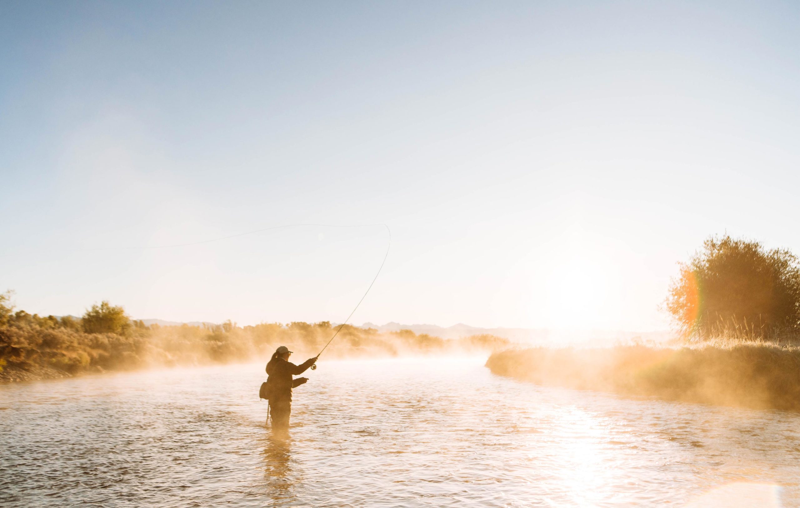 New-Thought-Visit-Pinedale-Wyoming-Ad-Photography-Woman-Fly-Fishiing-Green-River-Sunrise-fullscreen