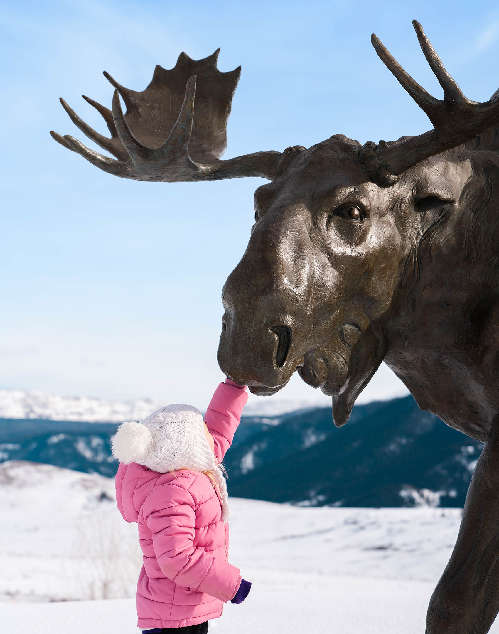 New-Thought-National-Museum-of-Wildlife-Art-Ad-Photography-Girl-Touching-Moose-Sculpture-Trail-Winter-halffullscreen
