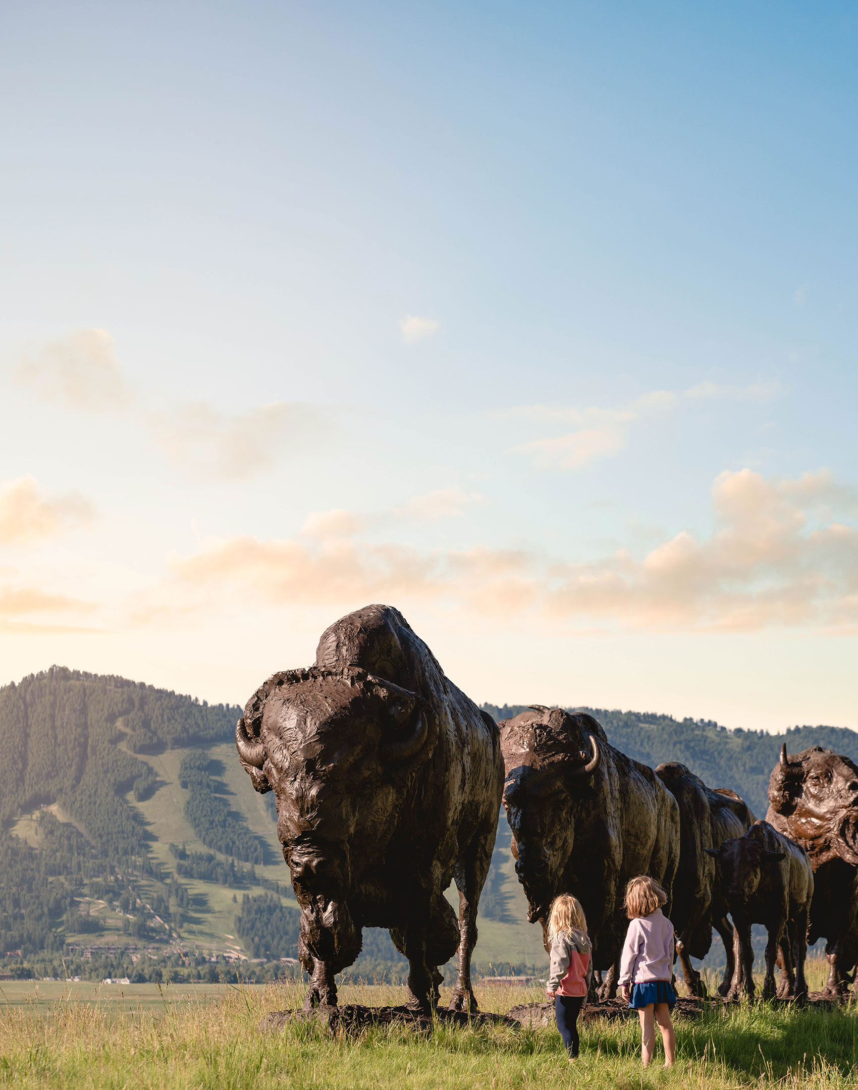 New-Thought-National-Museum-of-Wildlife-Art-Ad-Photography-Girls-Looking-At-Bison-Sculpture-Trail-Summer-halffullscreen