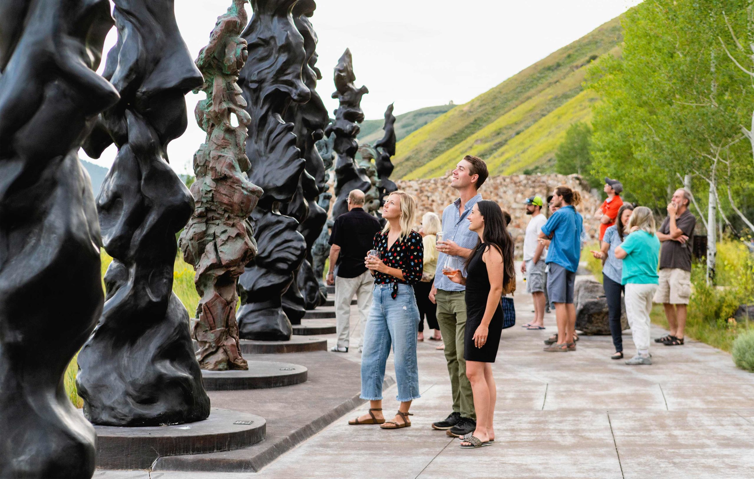 New-Thought-National-Museum-of-Wildlife-Art-Ad-Photography-Three-Friends-Look-At-Spirit-Totems-Sculpture-By-Herb-Alpert-Event-Summer-fullscreen