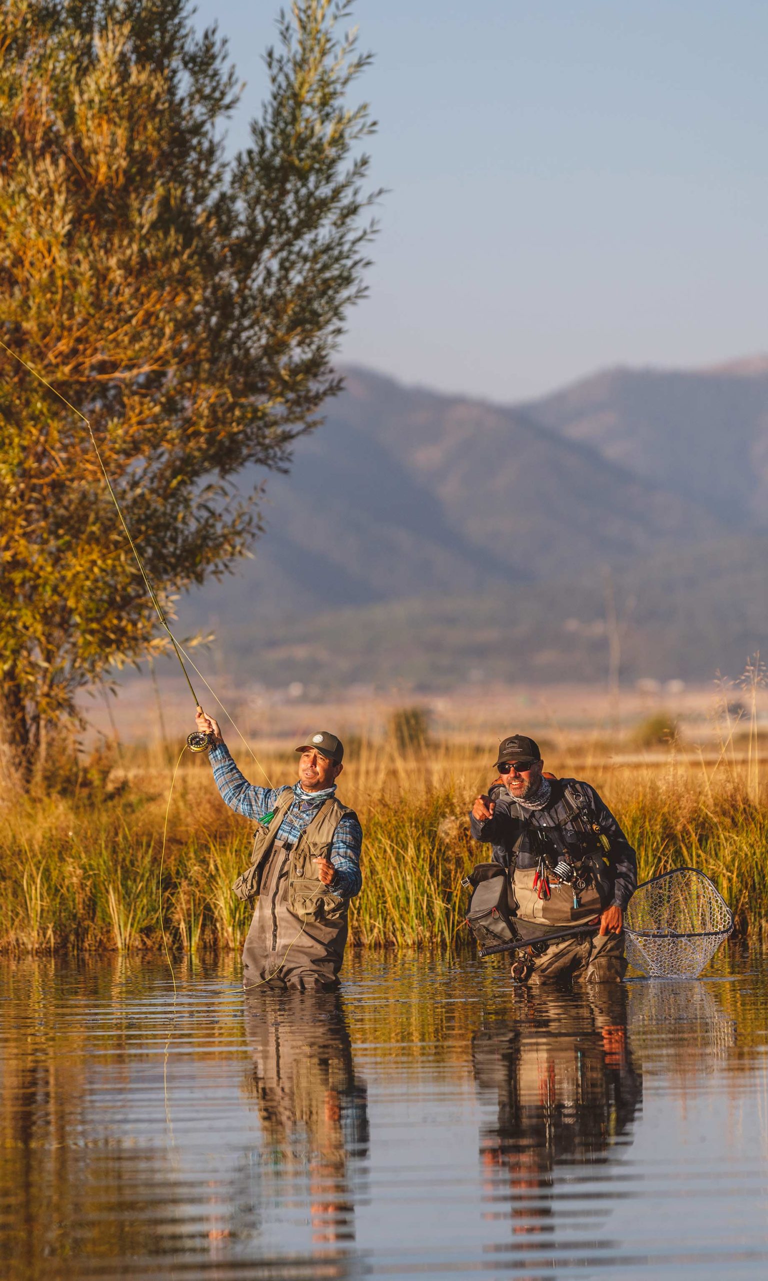 New-Thought-Tributary-Idaho-Ad-Photography-Two-Guys-Flyfishing-Front-Sunset-fullscreen-vert