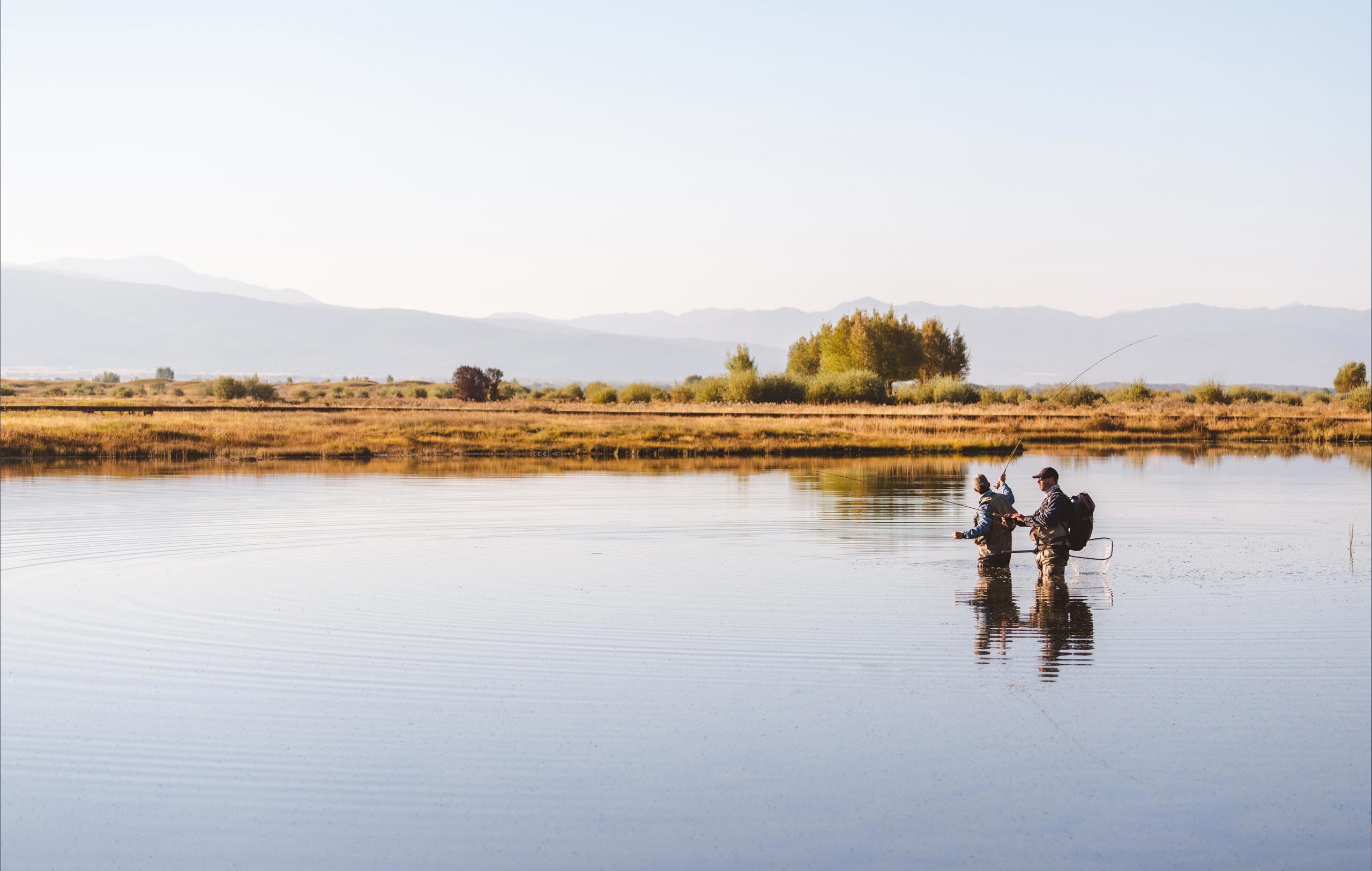 New-Thought-Tributary-Idaho-Ad-Photography-Two-Guys-Flyfishing-Sunset-fullscreen